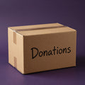Cardboard donation box with Donations handwritten in marker