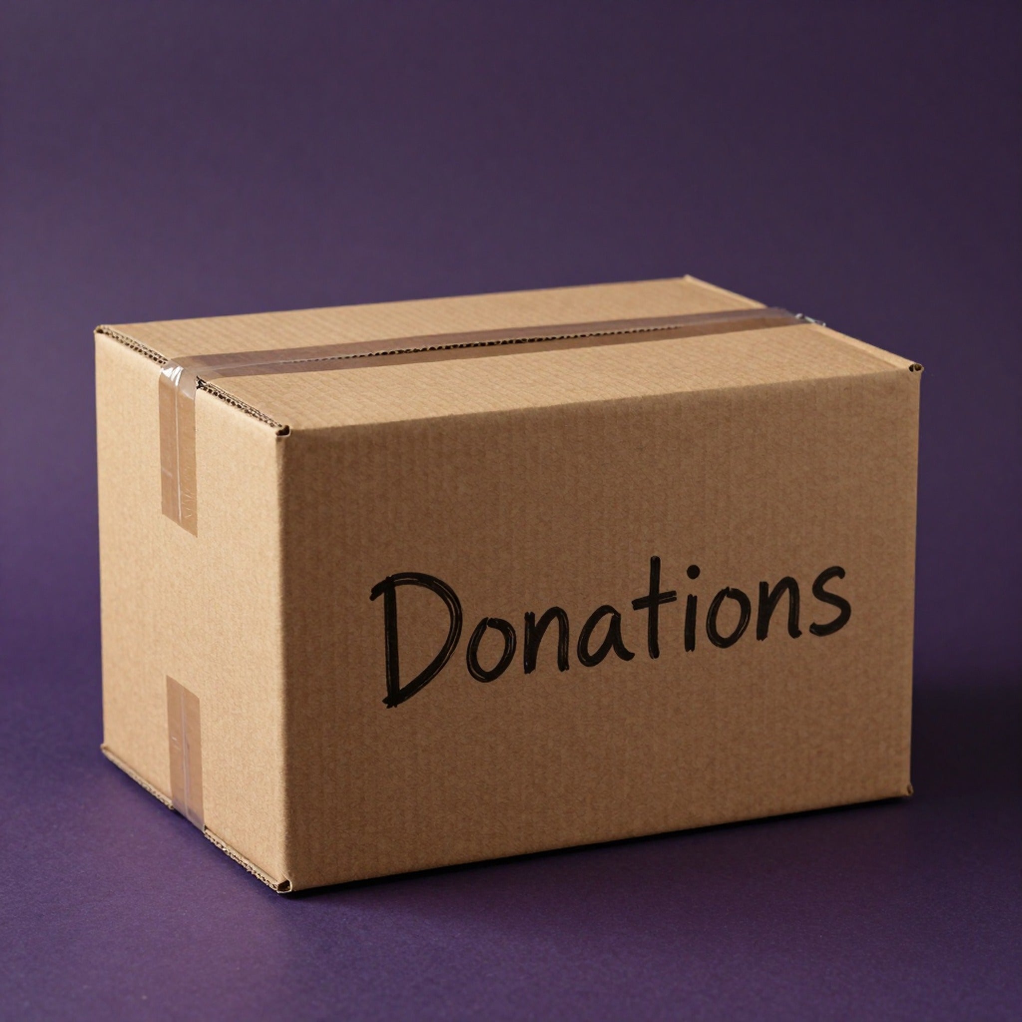 Cardboard donation box with Donations handwritten in marker